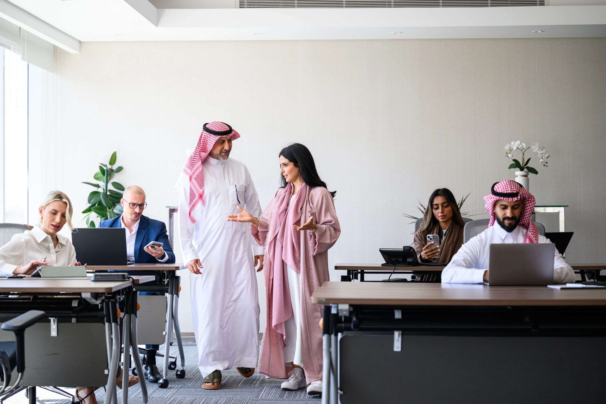 Global business team collaborating in a modern office