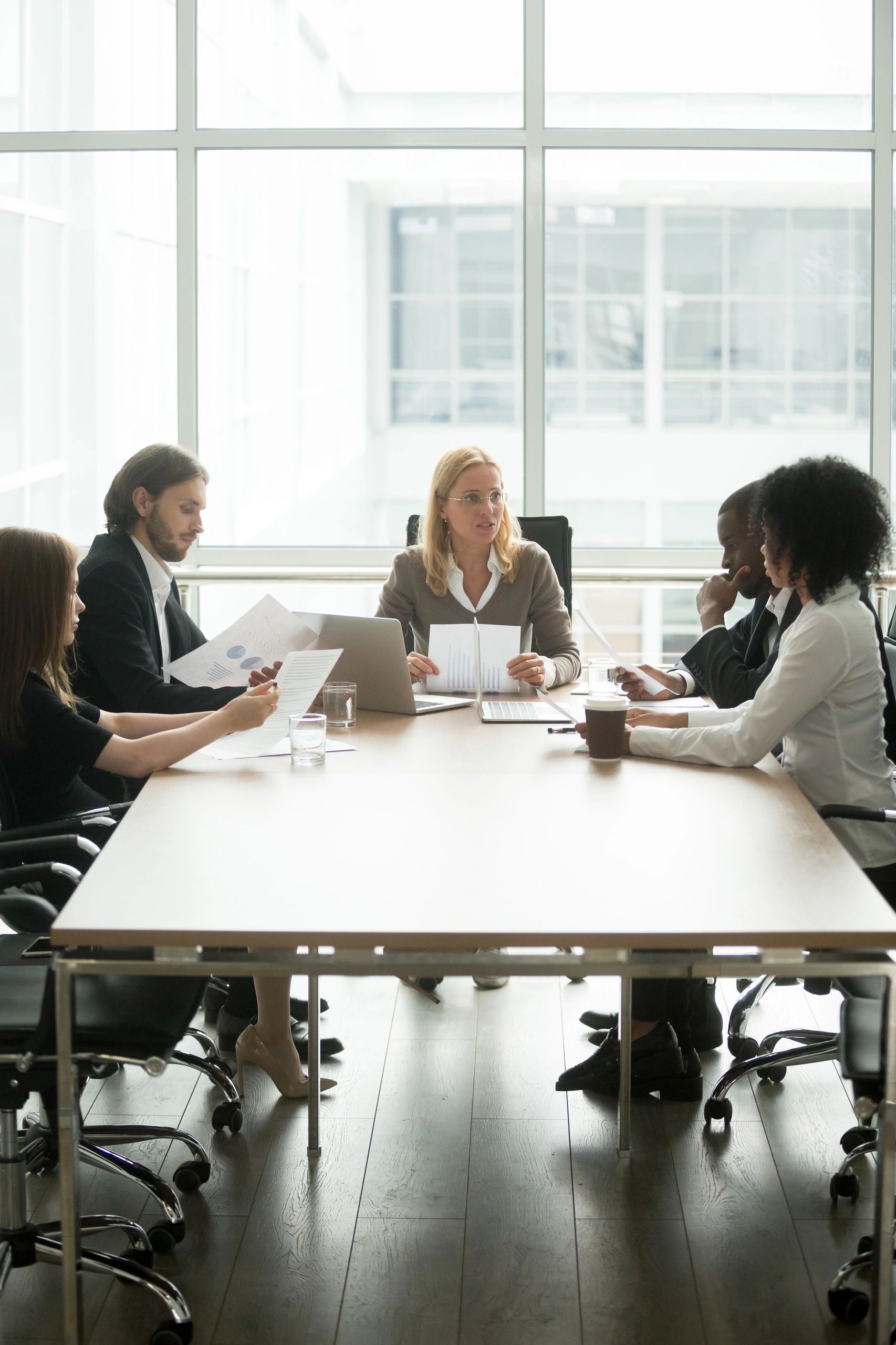 Advisory and investments leader in a boardroom discussion